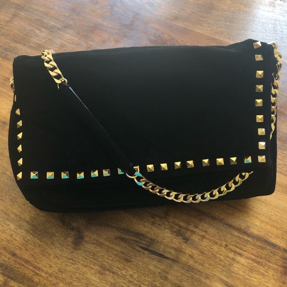black suede bag with gold chain